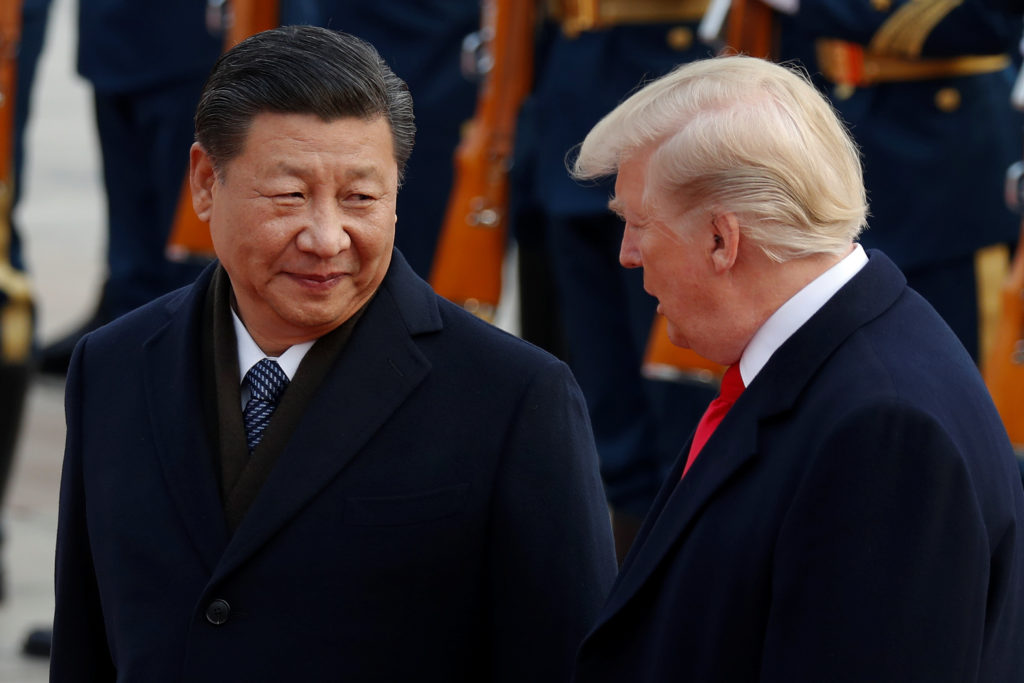 U.S. President Donald Trump takes part in a welcoming ceremony with China's President Xi Jinping at the Great Hall of the ...