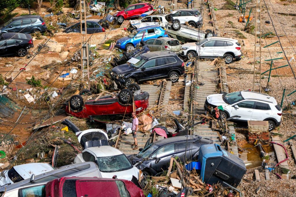 Is it safe to travel to Spain and should I cancel my holiday after flooding disaster?