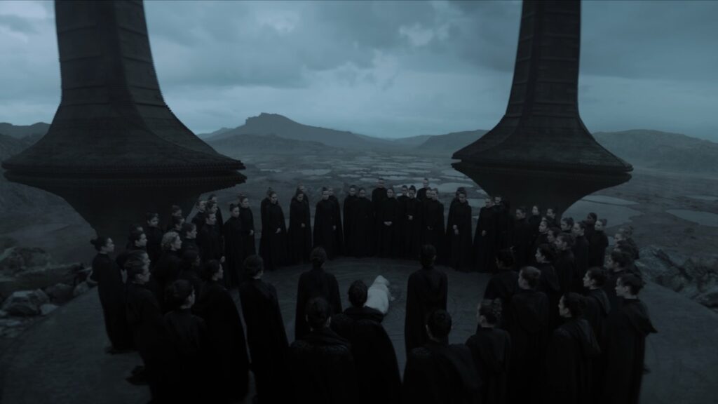 A gathering of the Sisterhood for a dark funeral in Dune: Prophecy episode 1.