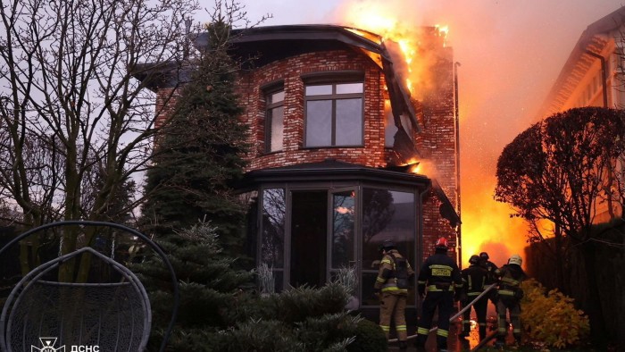 Firefighters at the site of a  missile strike in Dnipro, Ukraine, on Thursday