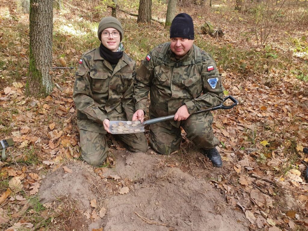 Father and Son Discover Rare Trove of 16th- and 17th-Century Silver Coins While Metal Detecting in a Polish Forest