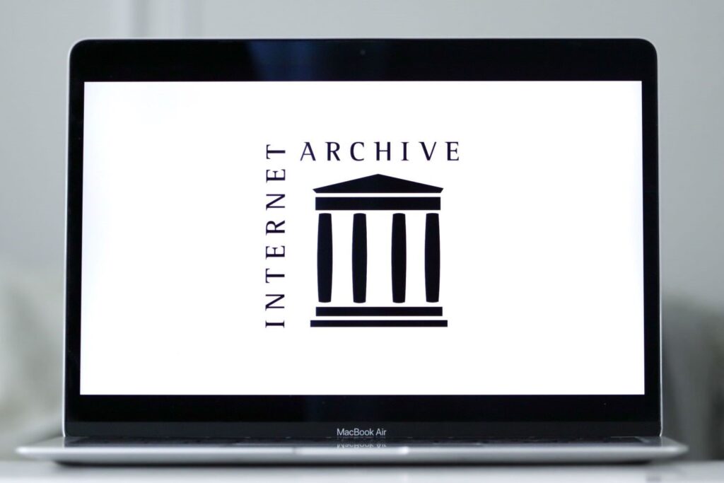 A computer showing the Internet Archive's logo.