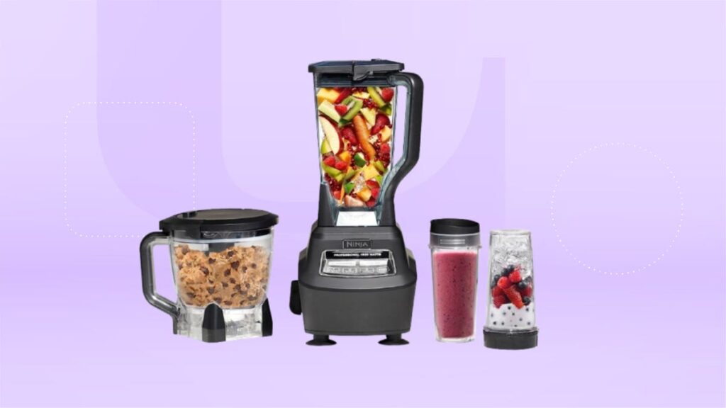 Ninja blender, food processor and smoothie cups displayed against a pale purple background