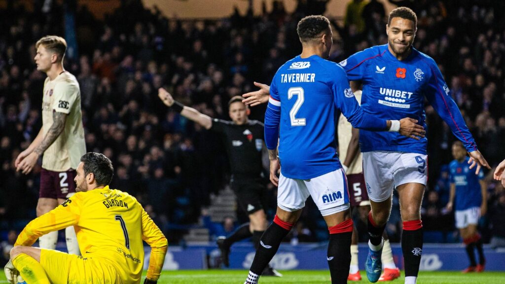 Rangers' Cyriel Dessers (R) celebrates scoring to make it 1-0 with teammate James Tavernier (L)