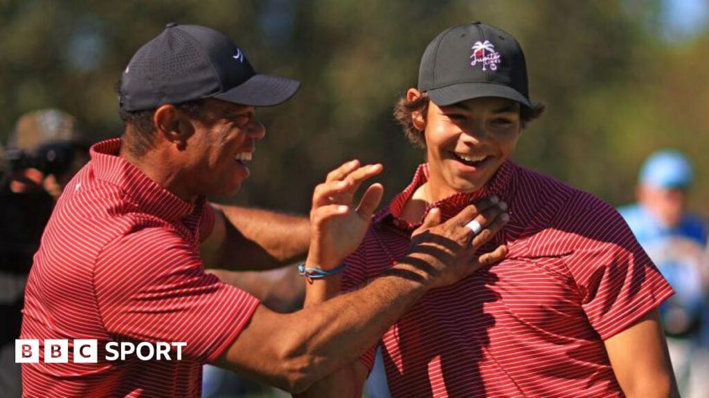 Tiger Woods of the United States reacts with his son Charlie Woods after holing out on the fourth hole during the second round of the PNC Championship at Ritz-Carlton Golf Club in Orlando, Florida