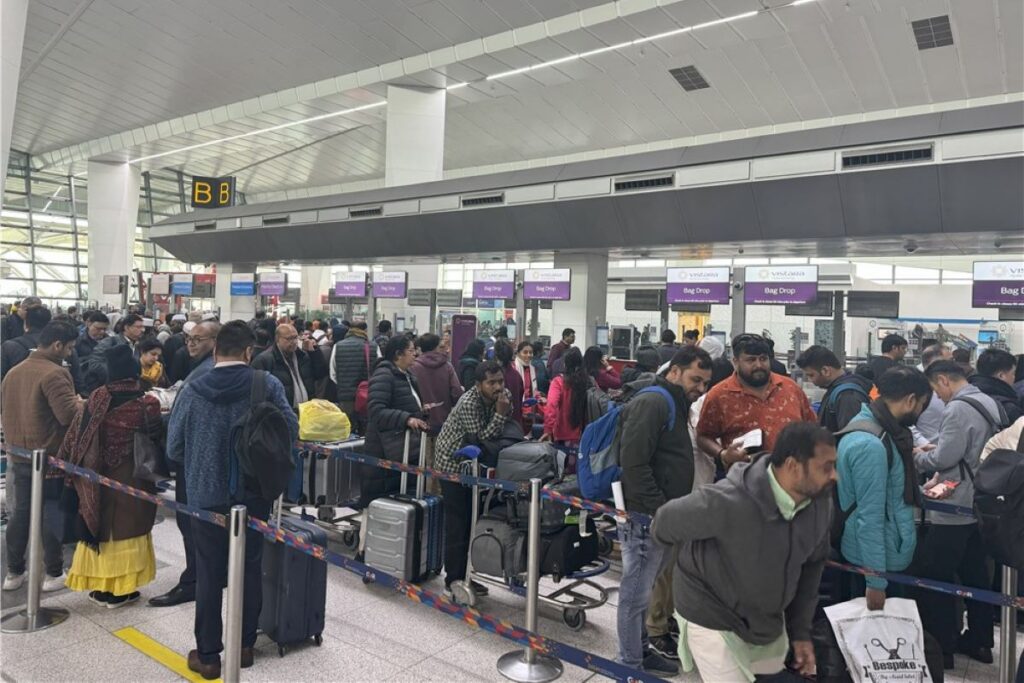 Passengers in queue at the Indira Gandhi International Airport in Delhi.