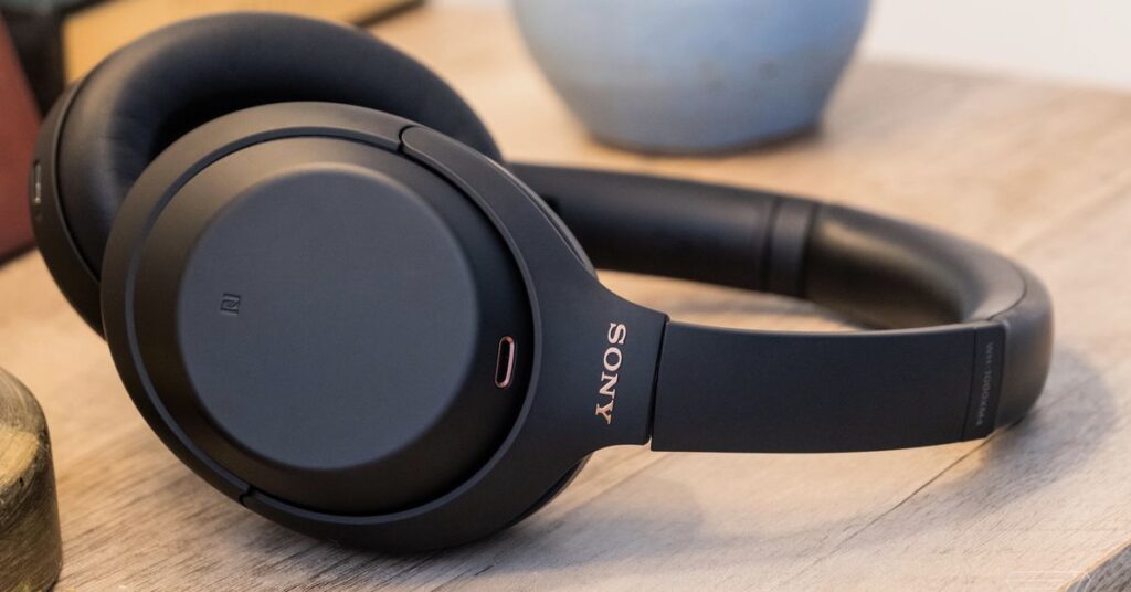 A photo of Sony’s WH-1000XM4, the best noise-canceling headphones for most people, resting on a table.