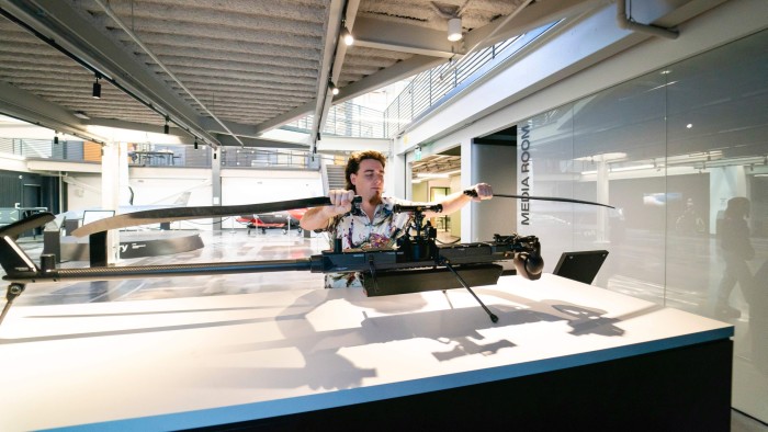 Palmer Luckey, founder of Anduril Industries, is seen disassembling the Anduril Ghost autonomous drone